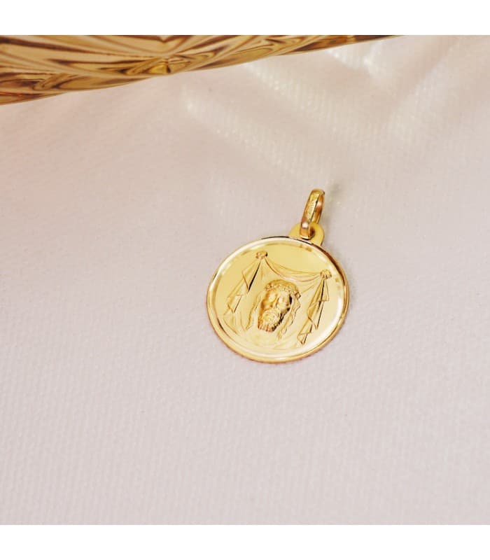 Alda Joyeros, joyería online. Medalla Cristo Santa Faz Oro 18K 18mm Bisel