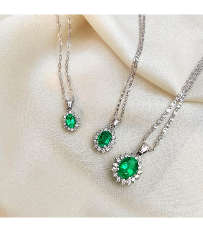 Colgantes de mujer en oro blanco. Colgantes con piedra esmeralda colombiana. Piedra preciosa verde.